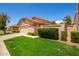 Single-story home with attached garage and well-manicured lawn at 8814 E Sunnyside Dr, Scottsdale, AZ 85260