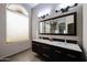 Bathroom with double vanity and large mirror at 656 W Johnson Dr, Gilbert, AZ 85233