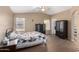Bright bedroom with ceiling fan, wood-look floors, and ample closet space at 745 E Megan St, Chandler, AZ 85225