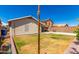 Large backyard with grassy area and a wooden post at 745 E Megan St, Chandler, AZ 85225