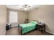 Charming bedroom with a ceiling fan and window at 745 E Megan St, Chandler, AZ 85225