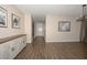 Bright hallway with hardwood floors and neutral walls at 10773 W Swayback W Pass, Peoria, AZ 85383