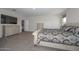 Spacious main bedroom with large bed and dresser at 10773 W Swayback W Pass, Peoria, AZ 85383
