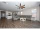 Open living area with grey sectional sofa and ceiling fan at 10773 W Swayback W Pass, Peoria, AZ 85383