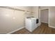 Laundry room with washer, dryer, and ample shelving at 10773 W Swayback W Pass, Peoria, AZ 85383