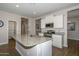 Modern kitchen with granite countertops and island at 10773 W Swayback W Pass, Peoria, AZ 85383