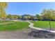 Park with grassy area, playground, and walking path at 10773 W Swayback W Pass, Peoria, AZ 85383