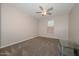 Bright bedroom with ceiling fan and carpet flooring at 10773 W Swayback W Pass, Peoria, AZ 85383