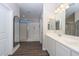 Elegant bathroom with double vanity and a large walk-in shower at 10773 W Swayback W Pass, Peoria, AZ 85383