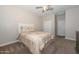 Bright bedroom with carpeted floor and double door closet at 10773 W Swayback W Pass, Peoria, AZ 85383