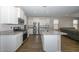 Open concept kitchen with island and stainless steel appliances at 10773 W Swayback W Pass, Peoria, AZ 85383