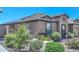 Single story home with solar panels and well-manicured landscaping at 10773 W Swayback W Pass, Peoria, AZ 85383
