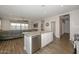 Modern kitchen with granite countertops and island at 10773 W Swayback W Pass, Peoria, AZ 85383
