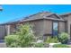 House exterior with solar panels and landscaped yard at 10773 W Swayback W Pass, Peoria, AZ 85383
