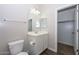 Clean bathroom with vanity, toilet, and linen closet at 10773 W Swayback W Pass, Peoria, AZ 85383