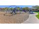 Modern playground with various play structures at 10773 W Swayback W Pass, Peoria, AZ 85383