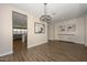 Open concept dining room with hardwood floors and chandelier at 10773 W Swayback W Pass, Peoria, AZ 85383