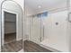 Modern bathroom with a large walk-in shower and grey tile floor at 10773 W Swayback W Pass, Peoria, AZ 85383