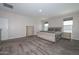Spacious bedroom with carpeted floor and large windows at 10773 W Swayback W Pass, Peoria, AZ 85383