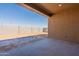 Large backyard with block wall and sandy area at 18938 W Ocotillo Rd, Waddell, AZ 85355