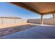 Covered patio and spacious backyard with block wall at 18950 W Ocotillo Rd, Waddell, AZ 85355