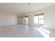 Bright dining area with tile floors and sliding glass doors leading to the backyard at 18950 W Ocotillo Rd, Waddell, AZ 85355