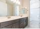 Double vanity bathroom with a large mirror and separate shower at 18950 W Ocotillo Rd, Waddell, AZ 85355