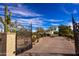 Ornate iron entrance gate leading to a luxurious property at 30009 N 58Th St, Cave Creek, AZ 85331