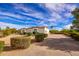 Exterior of a beautiful home with a long driveway and manicured landscaping at 30009 N 58Th St, Cave Creek, AZ 85331