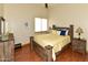 Bright bedroom with wood flooring and a queen-sized bed at 30009 N 58Th St, Cave Creek, AZ 85331