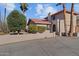 Two-story home with stucco exterior, red tile roof, and a long driveway at 690 W Mclean Dr, Wickenburg, AZ 85390