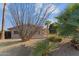 One-story home with stucco exterior, red tile roof, and desert landscaping at 690 W Mclean Dr, Wickenburg, AZ 85390