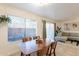 Open concept dining area with modern furniture and living room view at 3500 N Hayden Rd # 1005, Scottsdale, AZ 85251