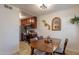 Bright dining area with wood table and chairs, adjacent to kitchen at 3500 N Hayden Rd # 1005, Scottsdale, AZ 85251
