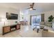 Living room with sectional sofa, TV, and dining area view at 3500 N Hayden Rd # 1005, Scottsdale, AZ 85251