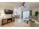 Living room with sectional sofa, TV, and dining area view at 3500 N Hayden Rd # 1005, Scottsdale, AZ 85251