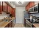 Kitchen with stainless steel appliances and wood cabinets at 3500 N Hayden Rd # 1005, Scottsdale, AZ 85251