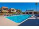 Community pool with surrounding lounge chairs at 3500 N Hayden Rd # 1005, Scottsdale, AZ 85251