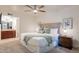 Spacious bedroom with a king-size bed, and ensuite bathroom access at 3500 N Hayden Rd # 1005, Scottsdale, AZ 85251