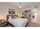 Bright bedroom with ceiling fan and mirrored closet doors at 3500 N Hayden Rd # 1005, Scottsdale, AZ 85251