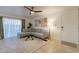 Living room with L-shaped sofa, coffee table, and access to patio at 3500 N Hayden Rd # 1005, Scottsdale, AZ 85251