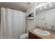 Bathroom with shower tub combo, vanity with granite countertop, and linen shelving at 3500 N Hayden Rd # 1005, Scottsdale, AZ 85251