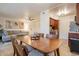 Dining area with wood table and chairs, open to living room and kitchen at 3500 N Hayden Rd # 1005, Scottsdale, AZ 85251