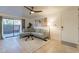 Bright living room with L-shaped sofa, and access to patio at 3500 N Hayden Rd # 1005, Scottsdale, AZ 85251