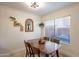 Dining area features a wood table and chairs with natural light at 3500 N Hayden Rd # 1005, Scottsdale, AZ 85251