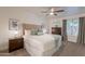 Main bedroom with king-size bed, ceiling fan, and ample closet space at 3500 N Hayden Rd # 1005, Scottsdale, AZ 85251