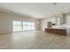 Open living area with large windows and tile flooring at 28894 N Phoebe Pl, Queen Creek, AZ 85144