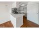 Updated kitchen with white cabinets, stainless steel appliances, and wood flooring at 4730 W Northern Ave # 3067, Glendale, AZ 85301