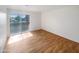 Bright bedroom with wood floors and sliding door access to a private balcony at 4730 W Northern Ave # 3067, Glendale, AZ 85301