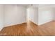 Hallway with wood flooring and access to bedrooms and other rooms at 4730 W Northern Ave # 3067, Glendale, AZ 85301